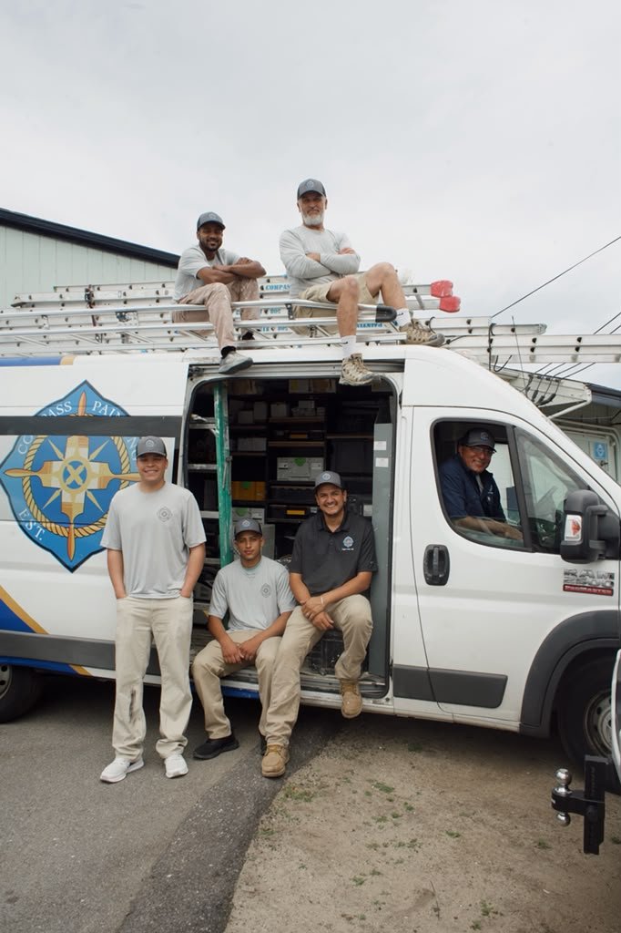 Compass Painting owners Ivan Junior and Leandro with the company team in Hyannis Cape Cod